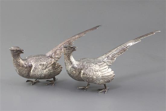 A modern matched pair of silver free-standing model pheasants, gross 20 oz.